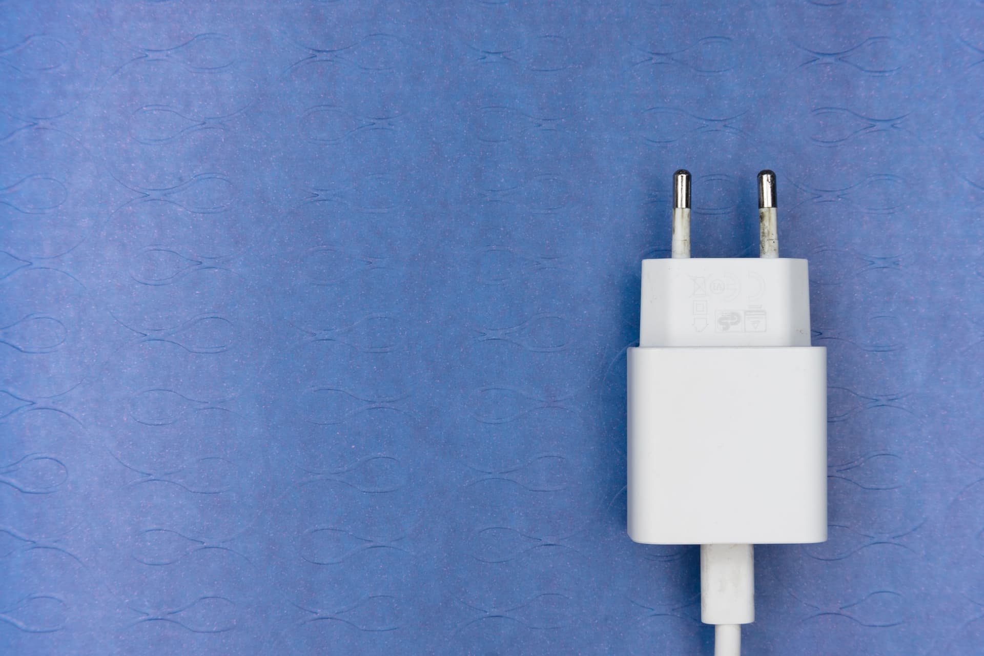 Illustrative photo of a plug-in carbon monoxide alarm with a digital display in a wall outlet