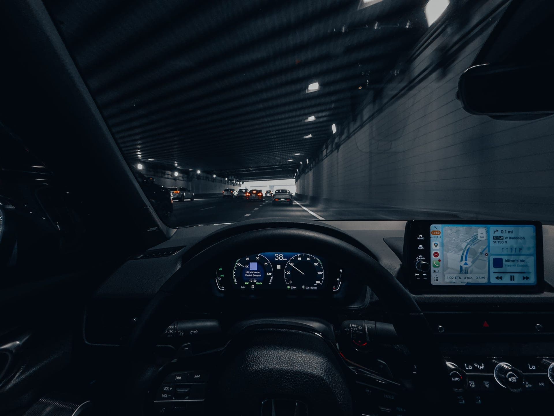 Car interior at night with the dashboard lit