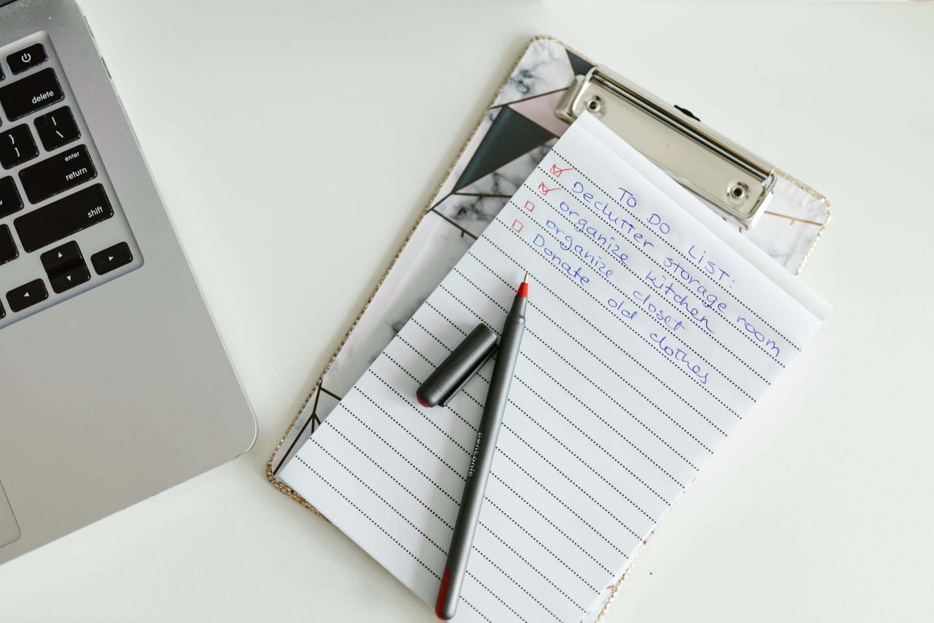 Clipboard with a checklist and a pen on a table