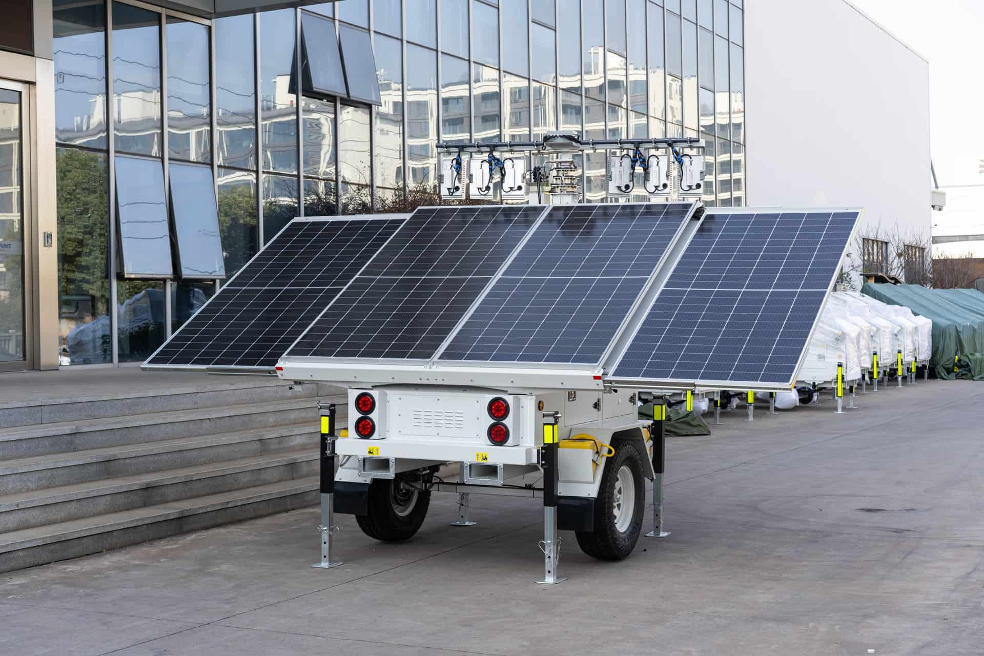Portable power equipment standing outdoors beside a building