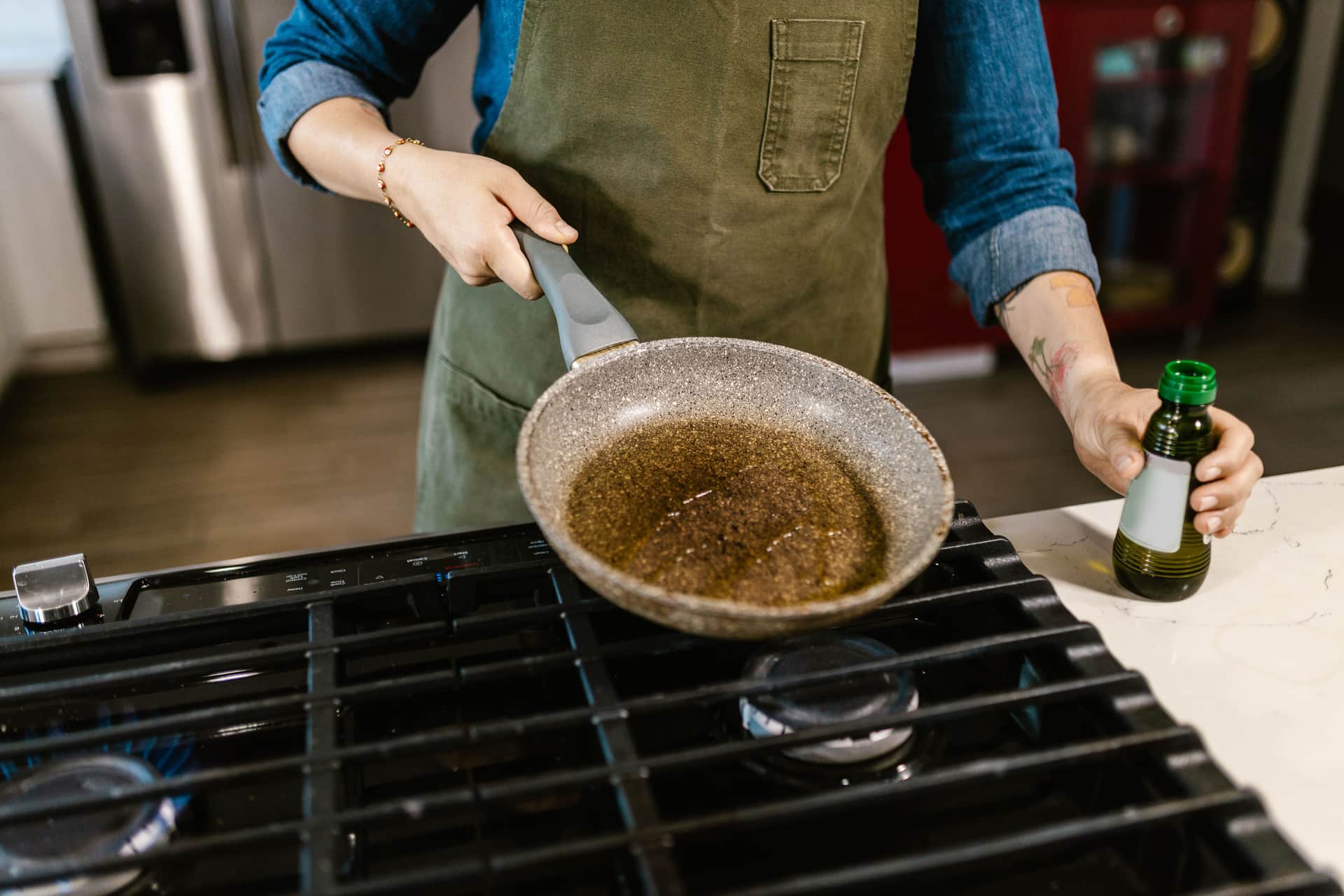 Frying pan on a hob with oil heating