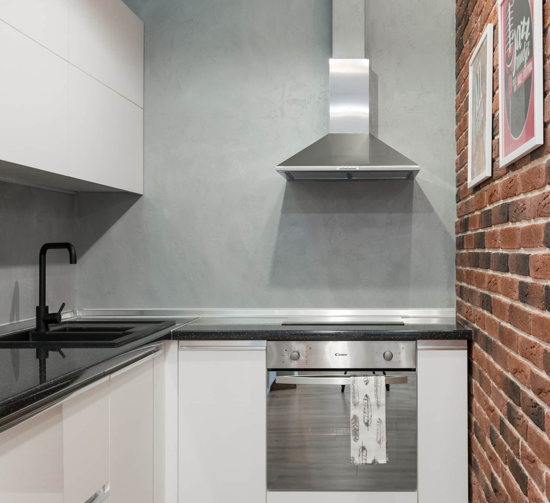 Open-plan kitchen with a range and an adjoining living space