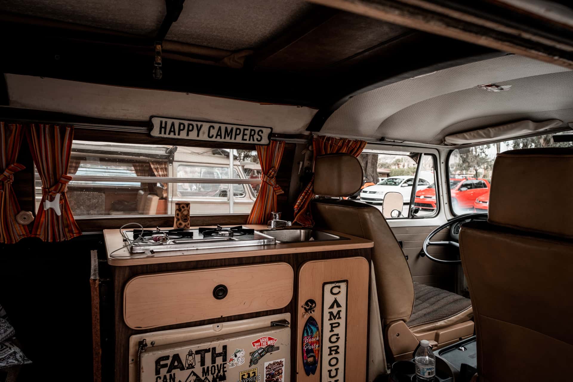 Interior of a camper van with a compact galley and burners